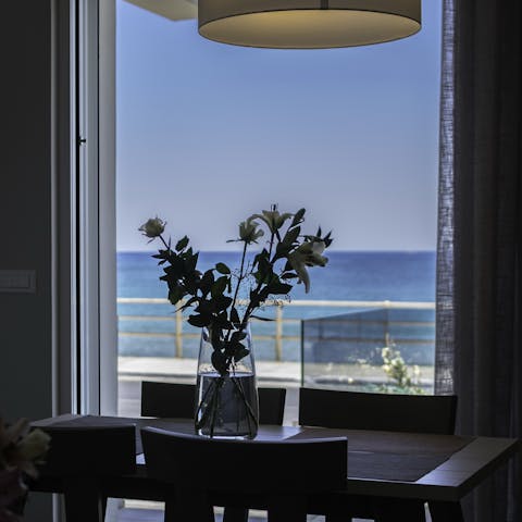 Admire the sparkling sea views from your elegant dining room