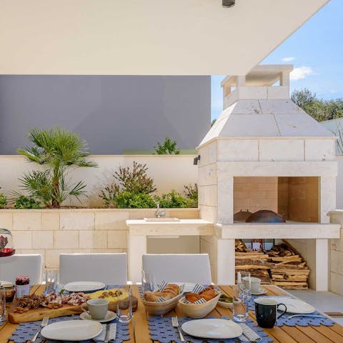 Cook on the traditional, stone-built barbecue and eat together on the covered terrace