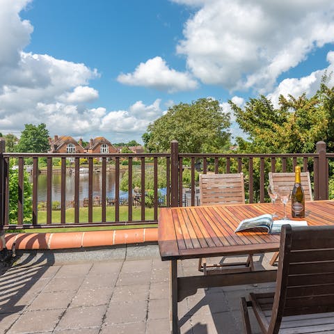 Take in the river views from the master bedroom's balcony