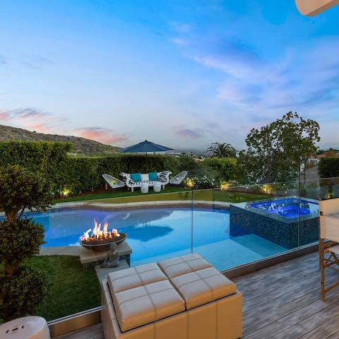 Enjoy a glass of Champagne around the fire pit by the pool