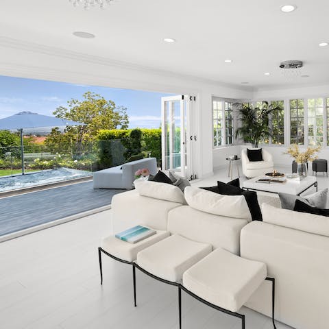 Open up the bi-fold doors to the gorgeous garden and take in the views over the mountains