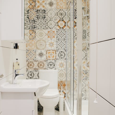 Admire the vintage-style tiles in the bathroom