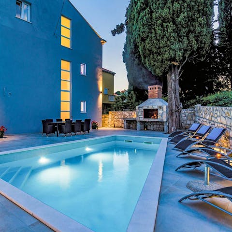 Take a moonlit swim in the private pool