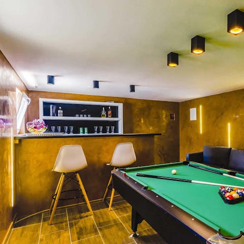Enjoy a gorgeous games room complete with a bar