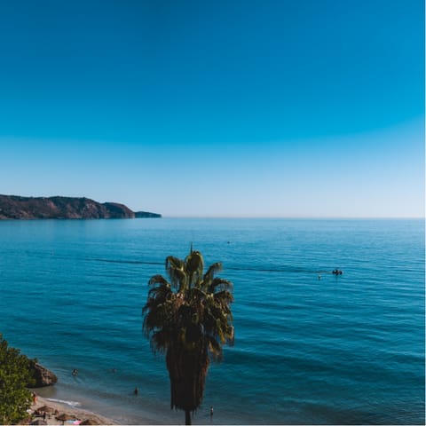 Start the day with a stroll along Playa Torrecilla, around 200 metres away