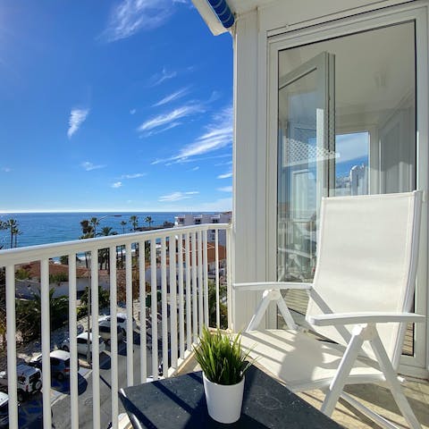 Read a good book and sip a glass of Rioja on the private balcony