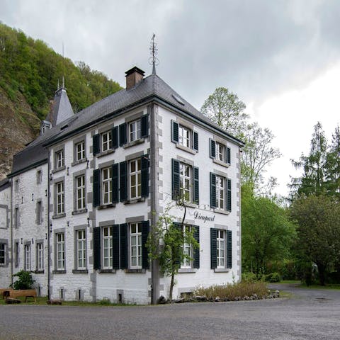 Stay in a traditional Belgian castle with wooden shutters and a tower