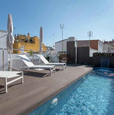 Sunbathe on this communal roof terrace and dip your toes in the plunge pool