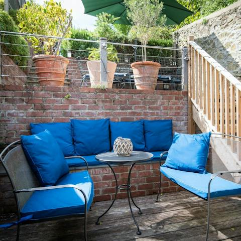 Relax with a cold drink on one of three tiered terraces outside