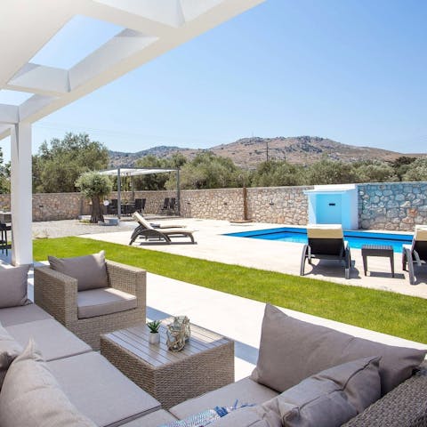 Sink into the comfy outdoor sofas, or lay out on the poolside loungers