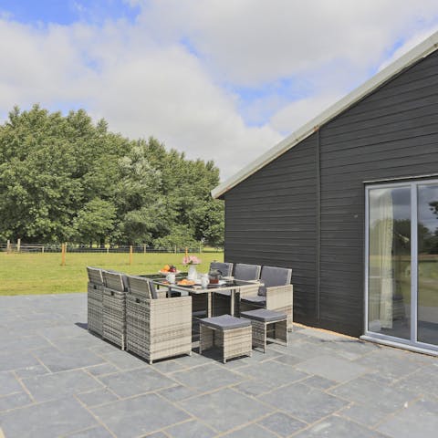 Pass carefree summer afternoons out on the home's patio
