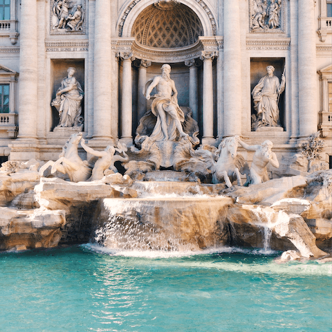 Marvel at the splendour of the Trevi Fountain, just a ten-minute walk away