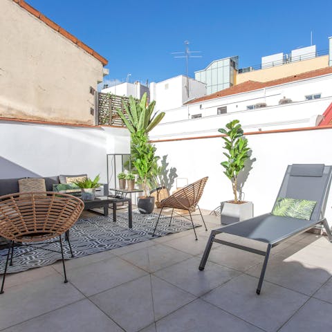 Soak up the sunshine from the private terrace with rooftop views