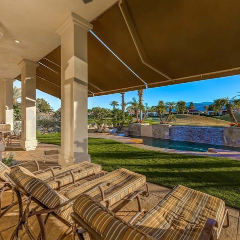 Catch some California sun on the plush day beds under the pergola 