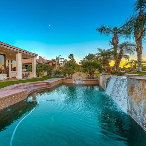 Stand under a saltwater waterfall in the private swimming  pool