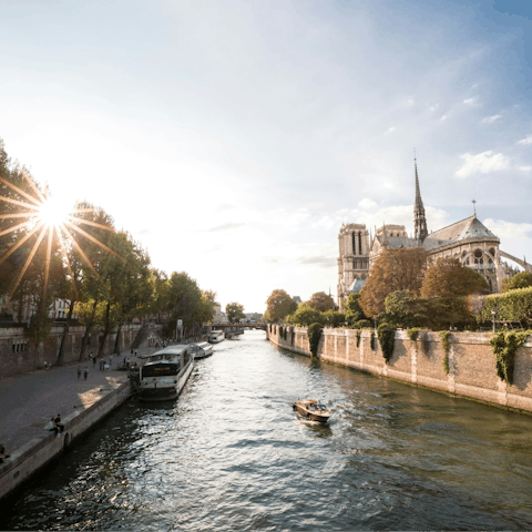 Stroll along the Seine to the nearby Notre Dame Cathedral