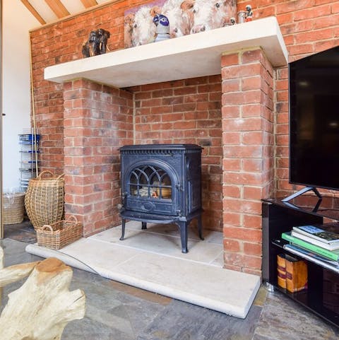 Spend a cosy evening in front of the traditional log-burning fireplace