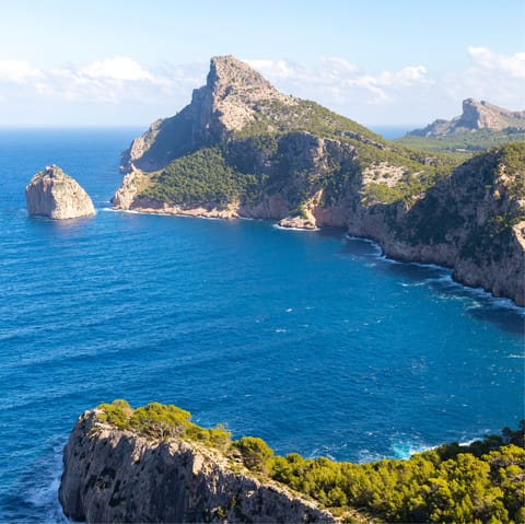 Head to the northernmost tip of the island, where the Tramuntana mountains meet the sea