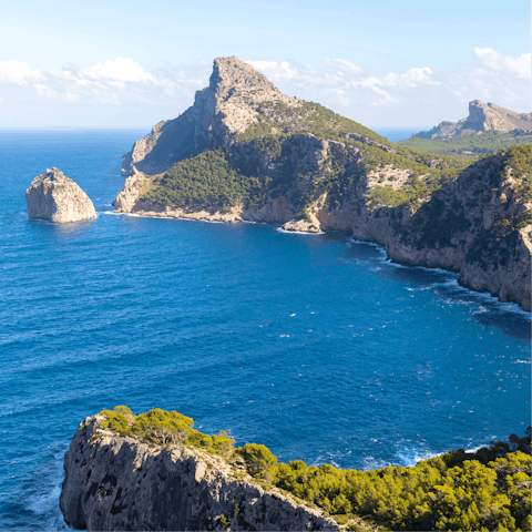 Head to the northernmost tip of the island, where the Tramuntana mountains meet the sea