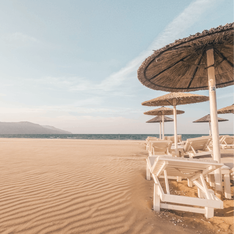 Sink your feet into the sand at Golden Beach, just a thirty-minute drive away