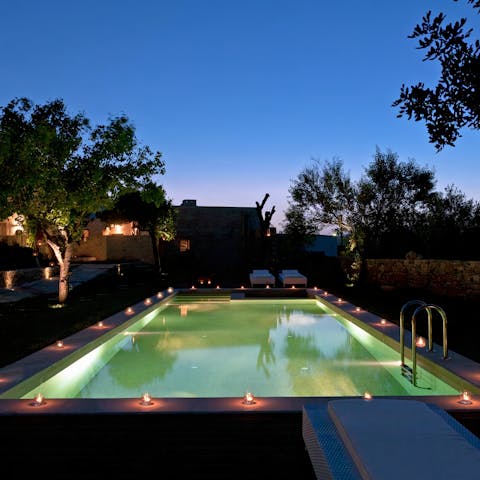 Take a late night dip in the pool, enjoying the ambience of the candle-style lights