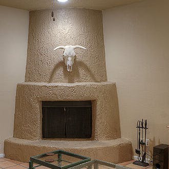 Gather around the traditional fireplace