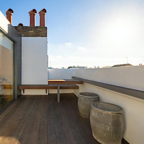 Start your day on the private rooftop terrace with views over the rooftops