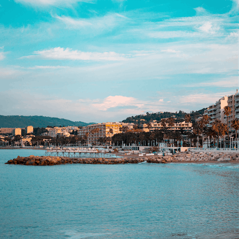 Discover the stunning palm-lined beaches of Cannes, just a short drive from your apartment