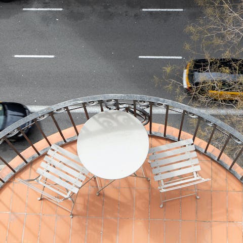 Start your mornings with a coffee on the balcony overlooking the lively streets below