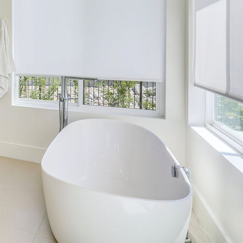 Take a long soak in the swanky freestanding bathtub