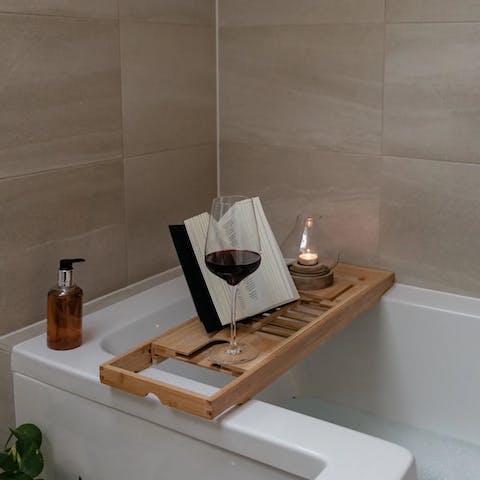 Soak in the bath with a glass of wine and a good book