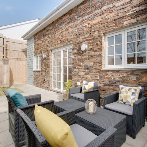 Enjoy drinks in the fenced garden on warm days
