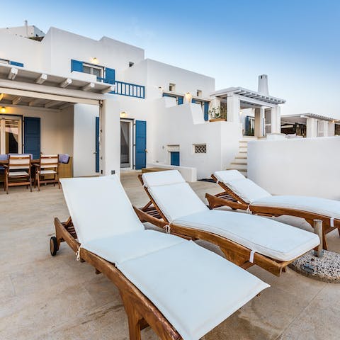 Lie back on one of the loungers and admire the view of the Aegean Sea