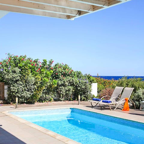 Recline on sun loungers before a refreshing dip in your private pool