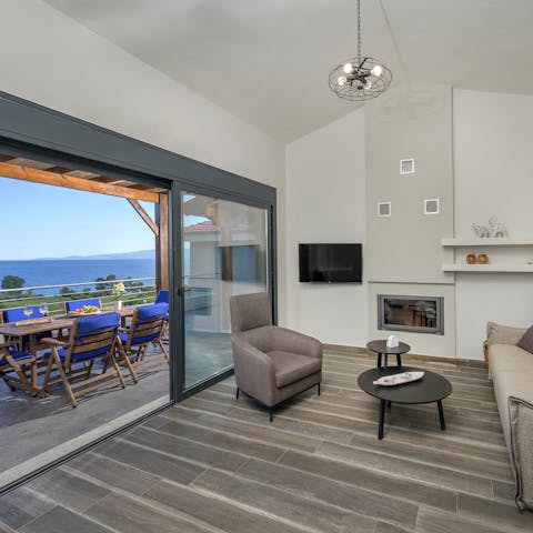 Take in beautiful sea views from the living room's sliding doors