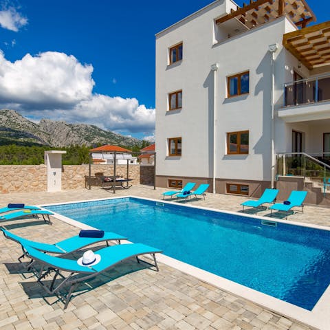 Take a cooling dip in the swimming pool with views of the Velebit mountains