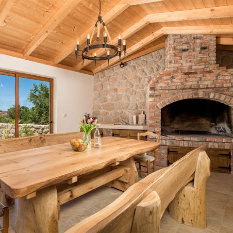 Dine together in front of an open fire