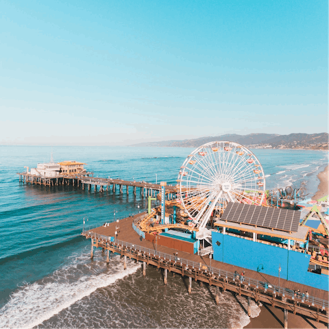 Drive down to Santa Monica Pier and stroll along the golden coast