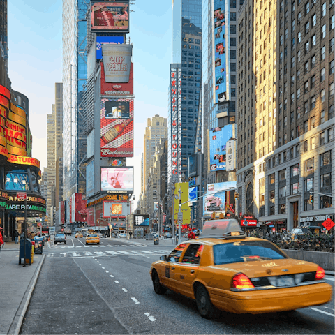 Catch a cab to the iconic Times Square and get lost in the bustle