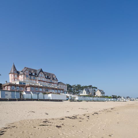 Stay in this former hotel and have a stroll along the Grande Plage, just footsteps away
