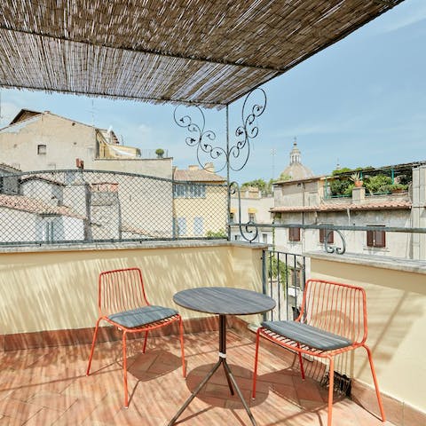 Watch the sunset over the city from one of your balconies while sipping on an aperitivo 