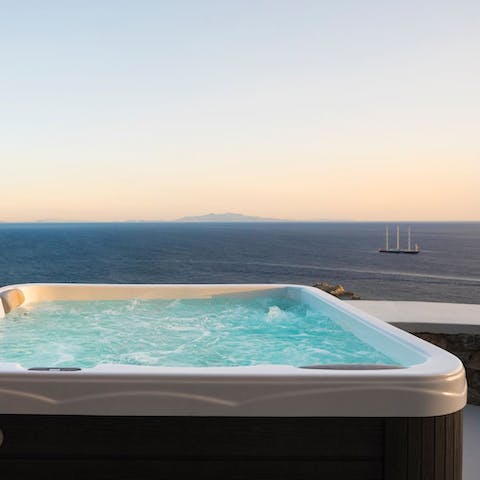 Relax in the hot tub with its sea vistas