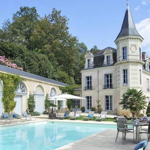 Feel like royalty as you sunbathe with the chateau towering over you 