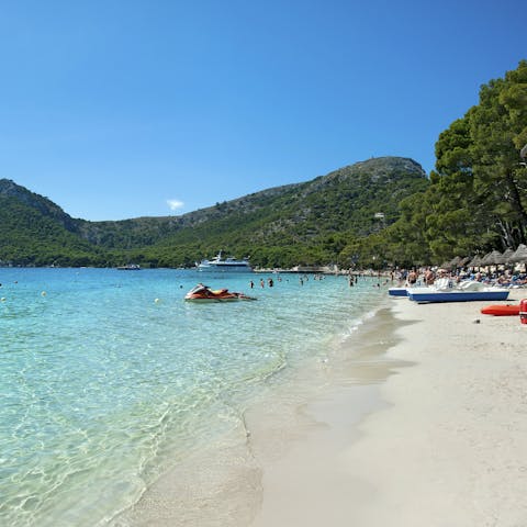 Make the 1km-journey over to Puerto Pollensa's beach and paddle in the Med