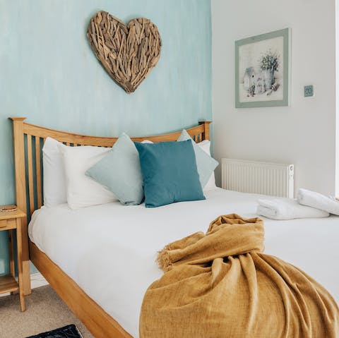 Sink into the comfortable bed after a busy afternoon by the sea