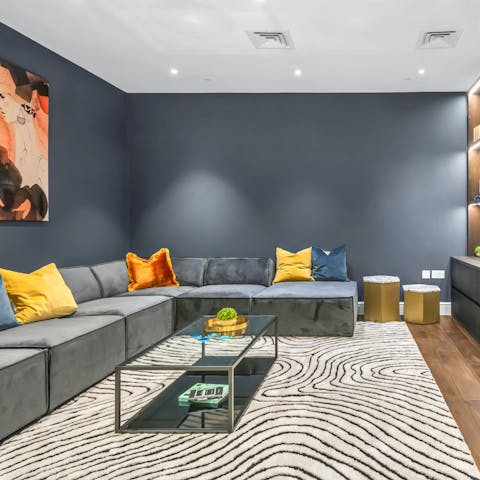 Host a movie night in the secondary living area with its cinema room set-up
