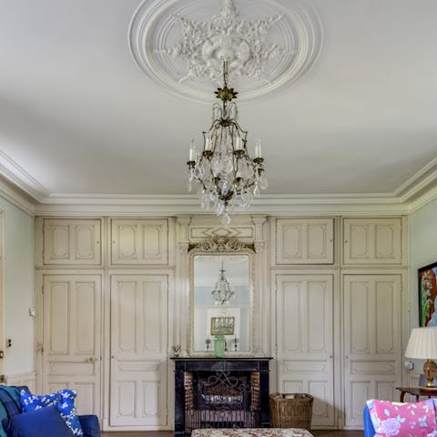 Gather in the grand sitting room in front of the cosy fireplace