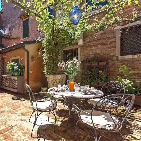Enjoy an afternoon glass of wine in the traditional courtyard