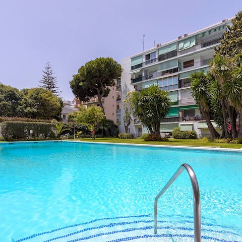 Slip into the refreshing waters of the communal swimming pool