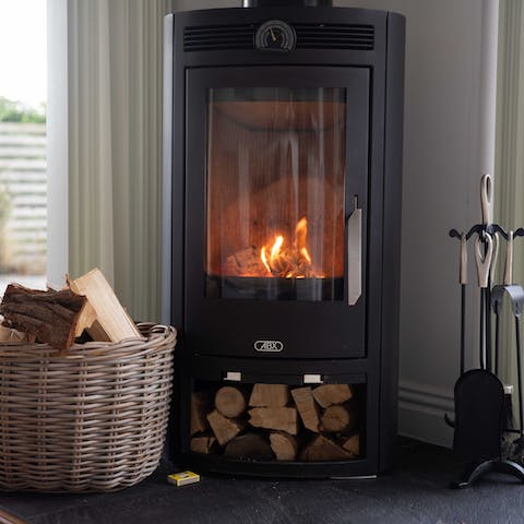 Cosy up by the wood-burning stove on colder nights